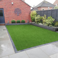 Simple low maintenance sandstone paving and artificial grass