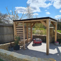 oak pergola and porcelain paving